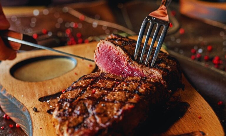 How Long Can Cooked Steak Sit Out: Ensuring Food Safety